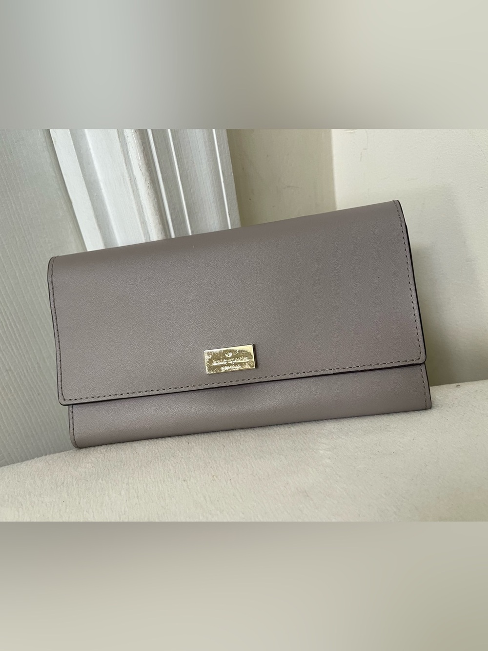kate spade Taupe Leather Foldover Clutch with Gold Plaque